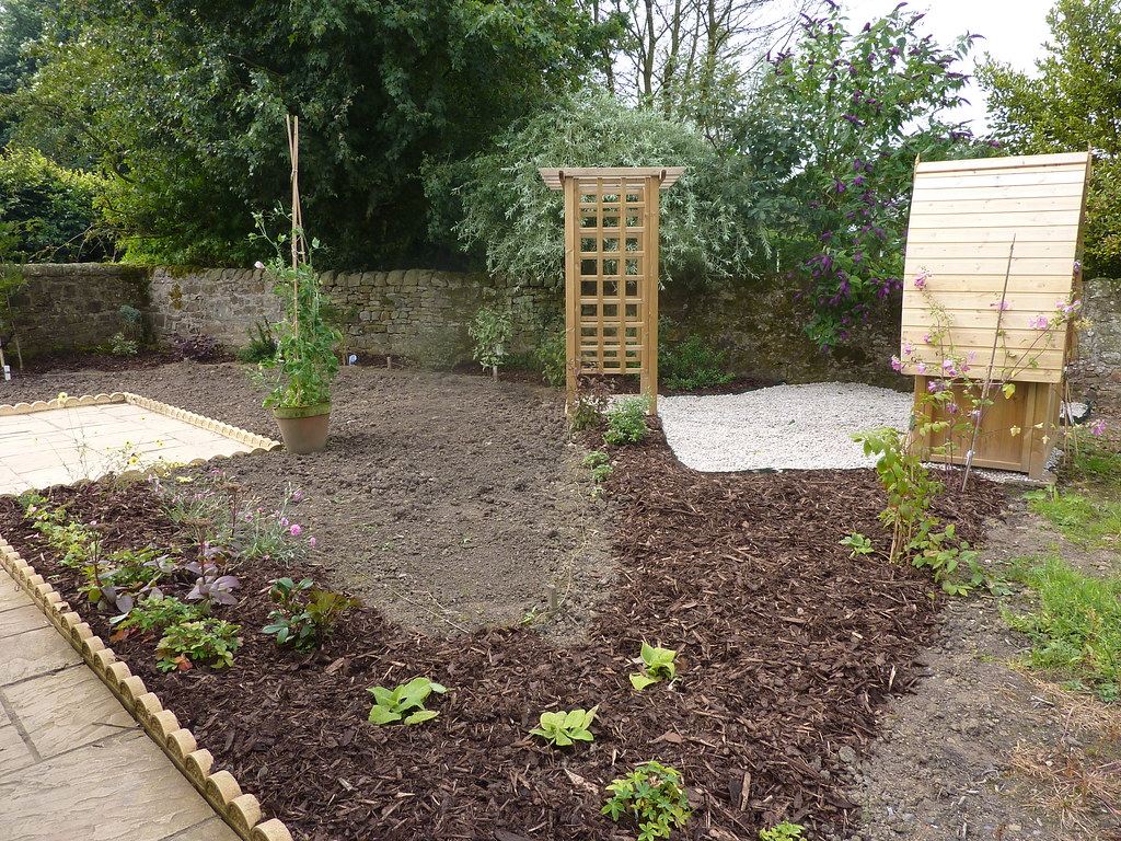 A freshly weeded and mulched planting bed