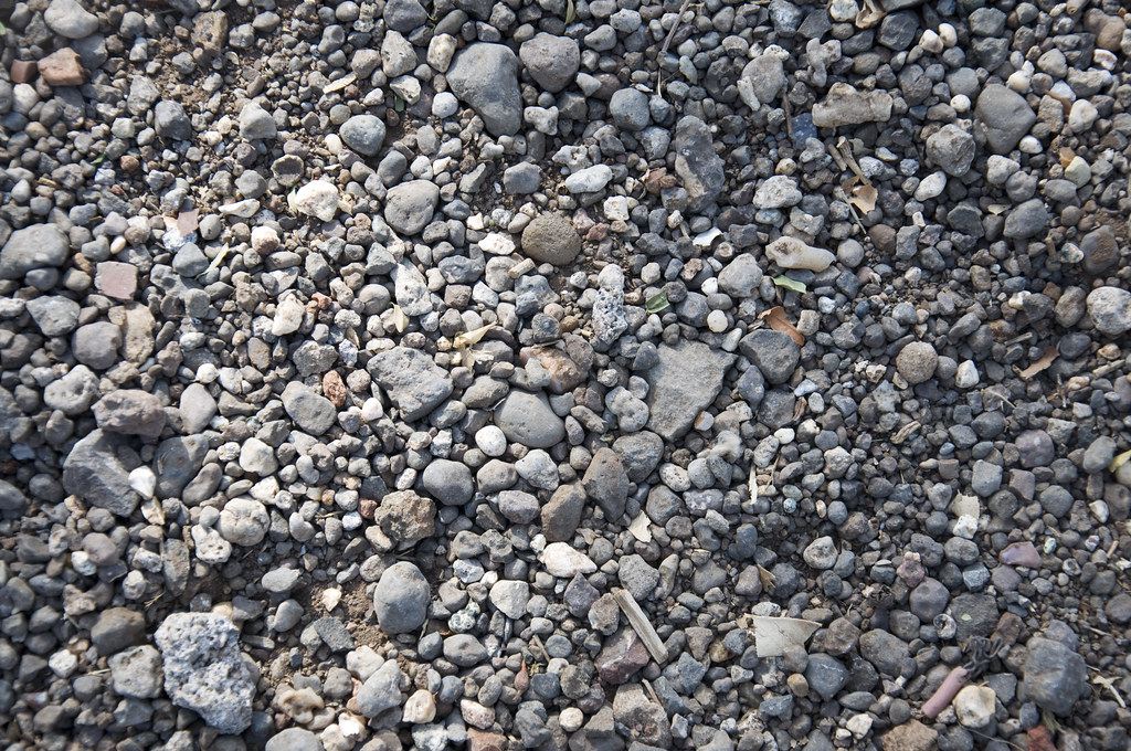 A planting bed finished with river rock