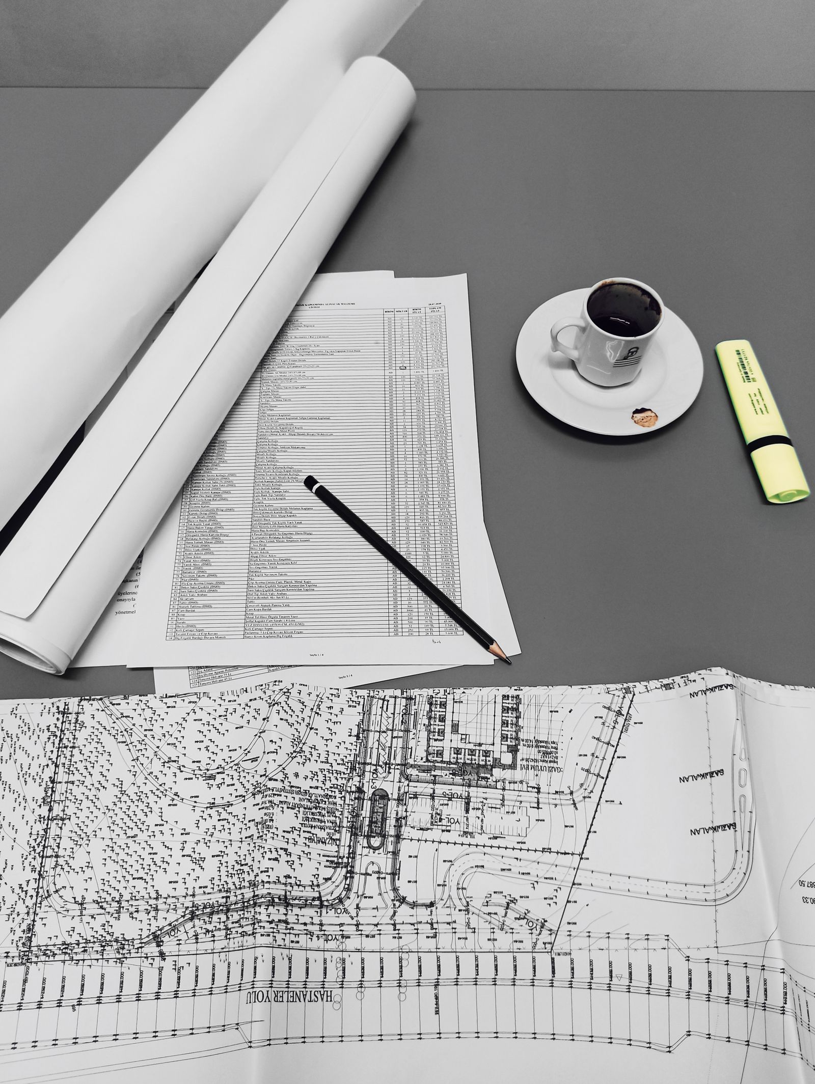 Blueprints and notes on a desk