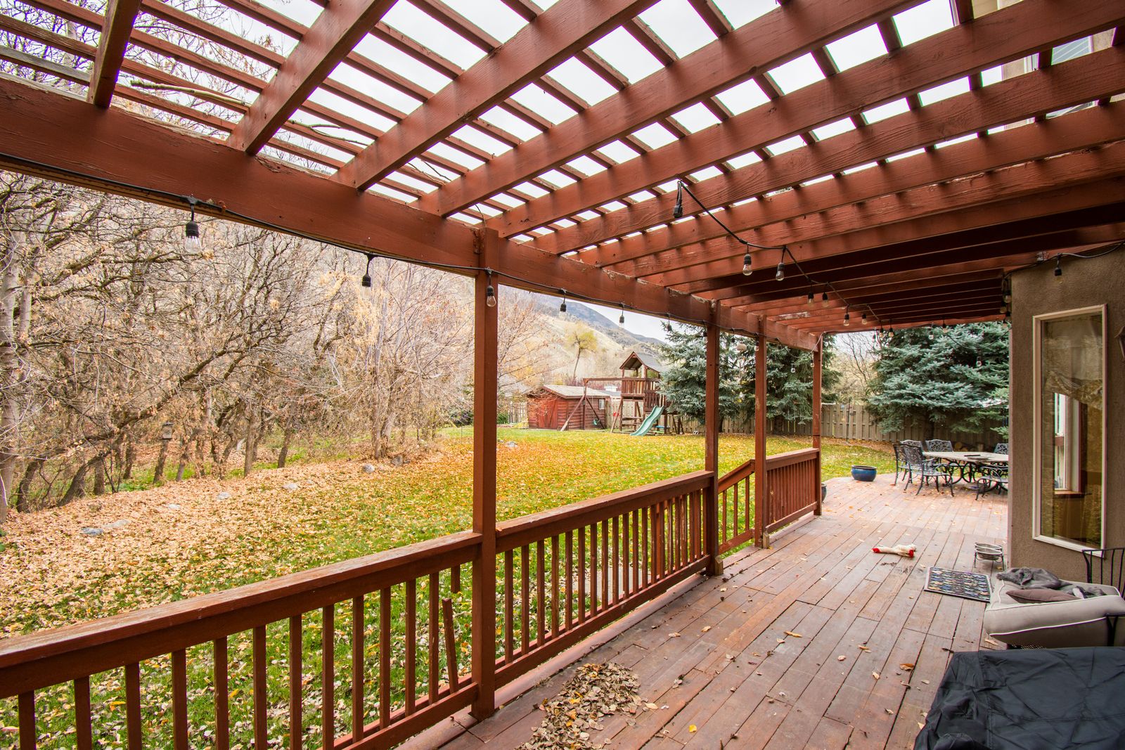 Wooden deck with autumn leaves