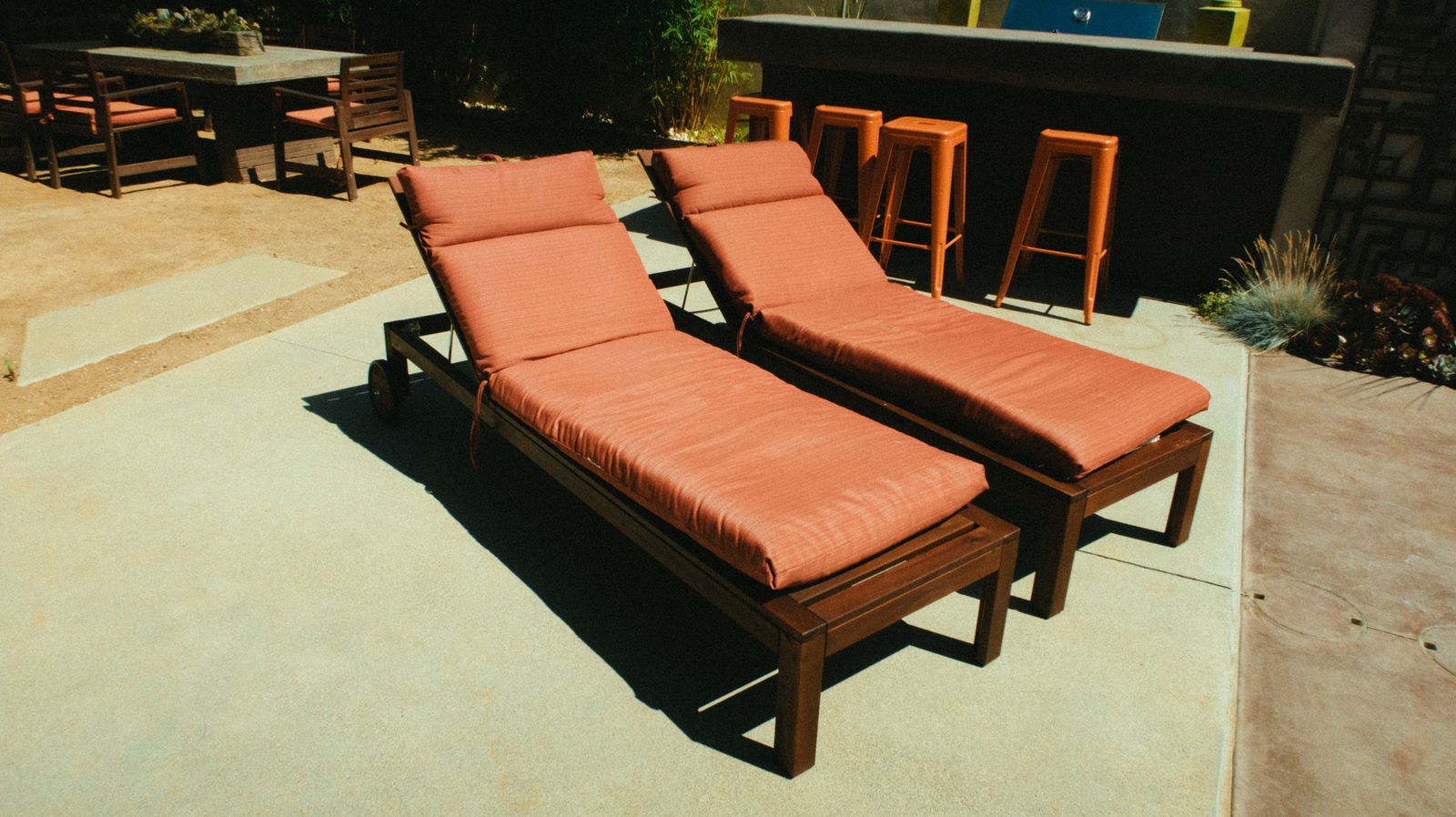 Wooden loungers on a modern patio