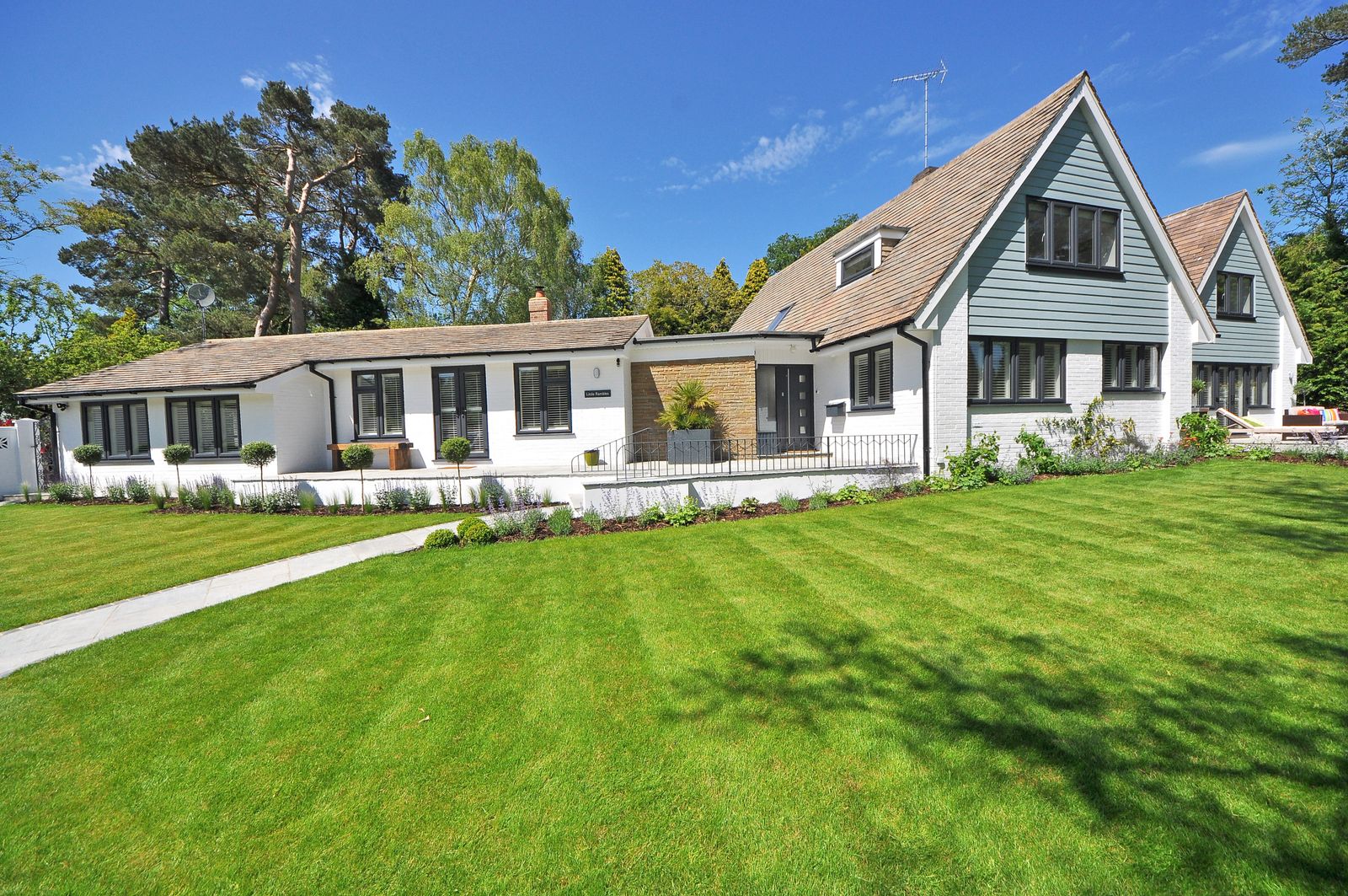 Lush green lawn in front of a family home